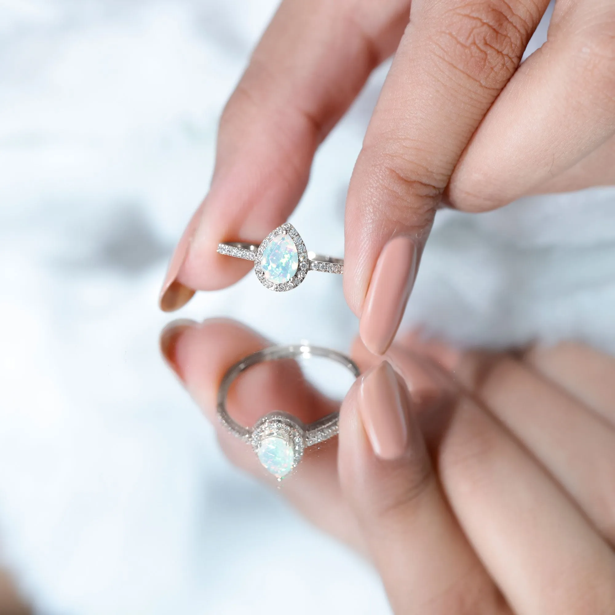 1 CT Pear Cut Ethiopian Opal Ring with Diamond Halo