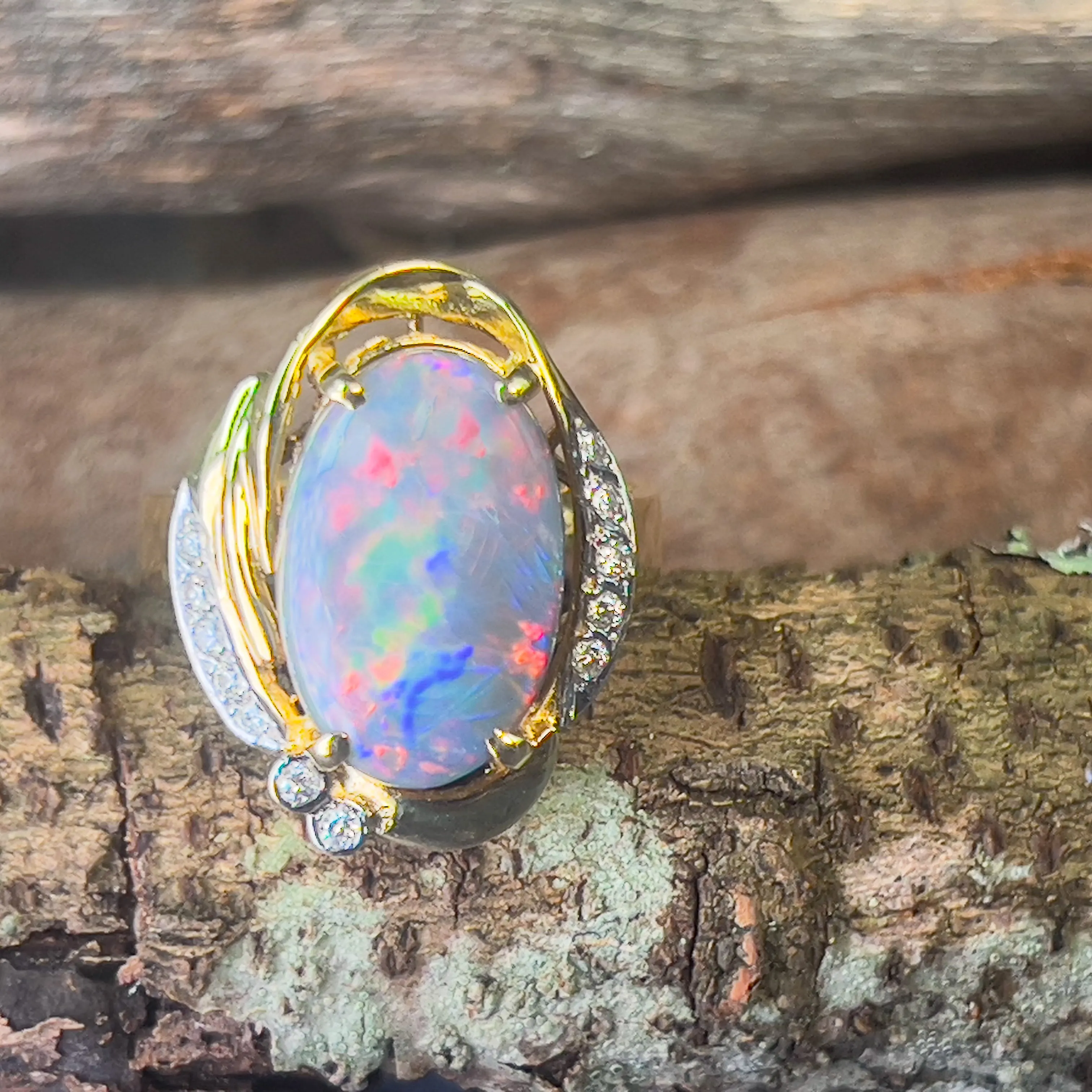 18kt Yellow Gold Black Opal Red flashes 4.86ct and diamond ring