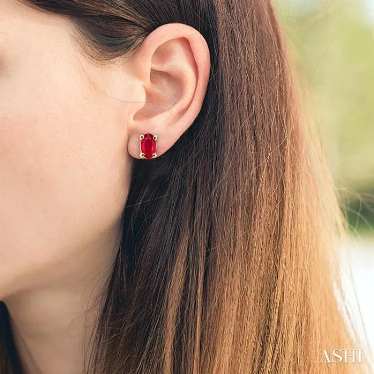 5x3MM Oval Cut Ruby Stud Earrings in 14K Yellow Gold