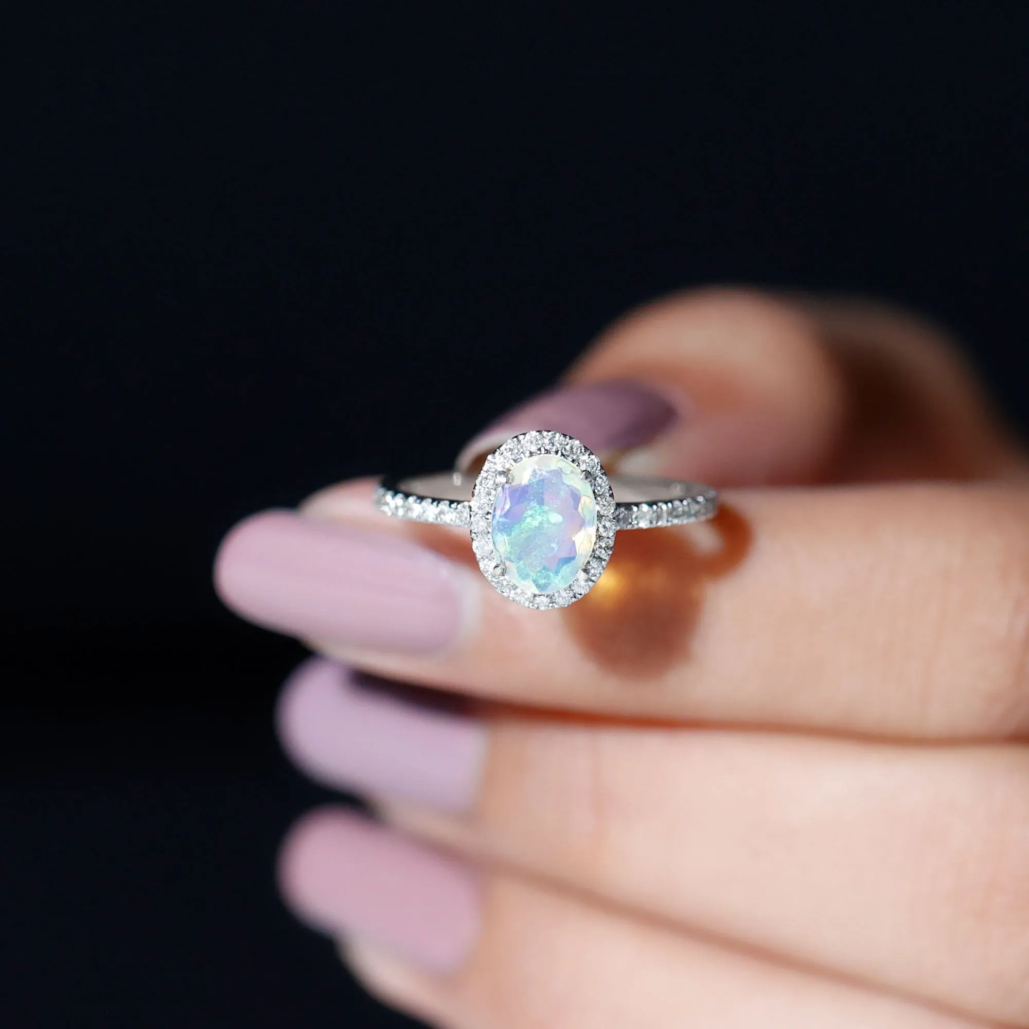 Oval Shape Ethiopian Opal and Diamond Halo Engagement Ring