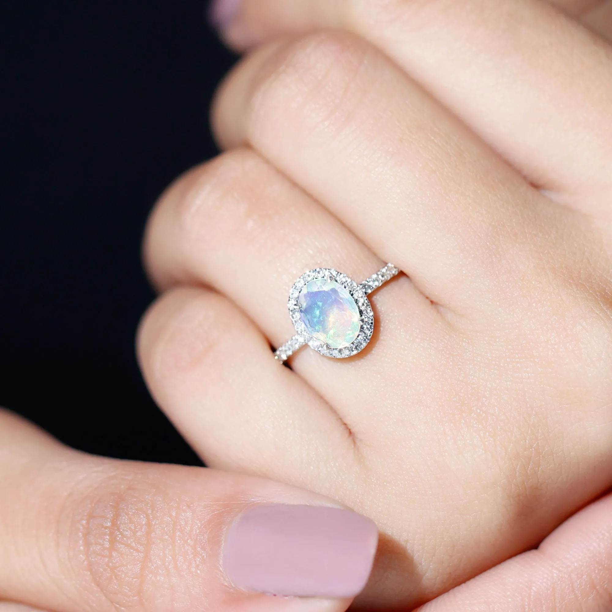 Oval Shape Ethiopian Opal and Diamond Halo Engagement Ring