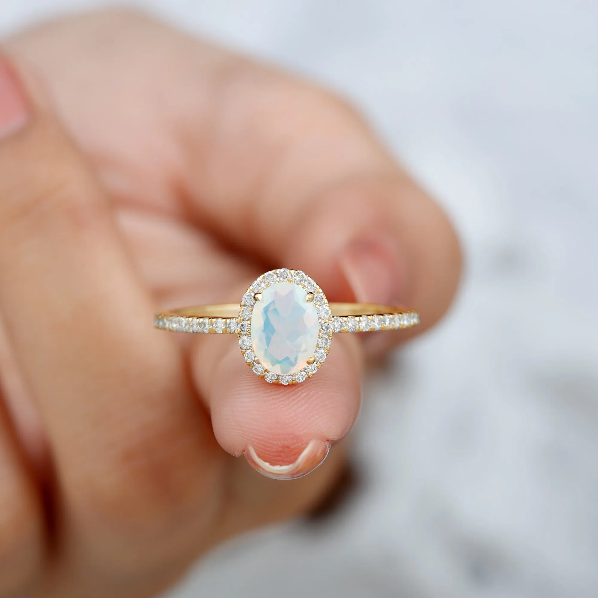 Oval Shape Ethiopian Opal and Diamond Halo Engagement Ring