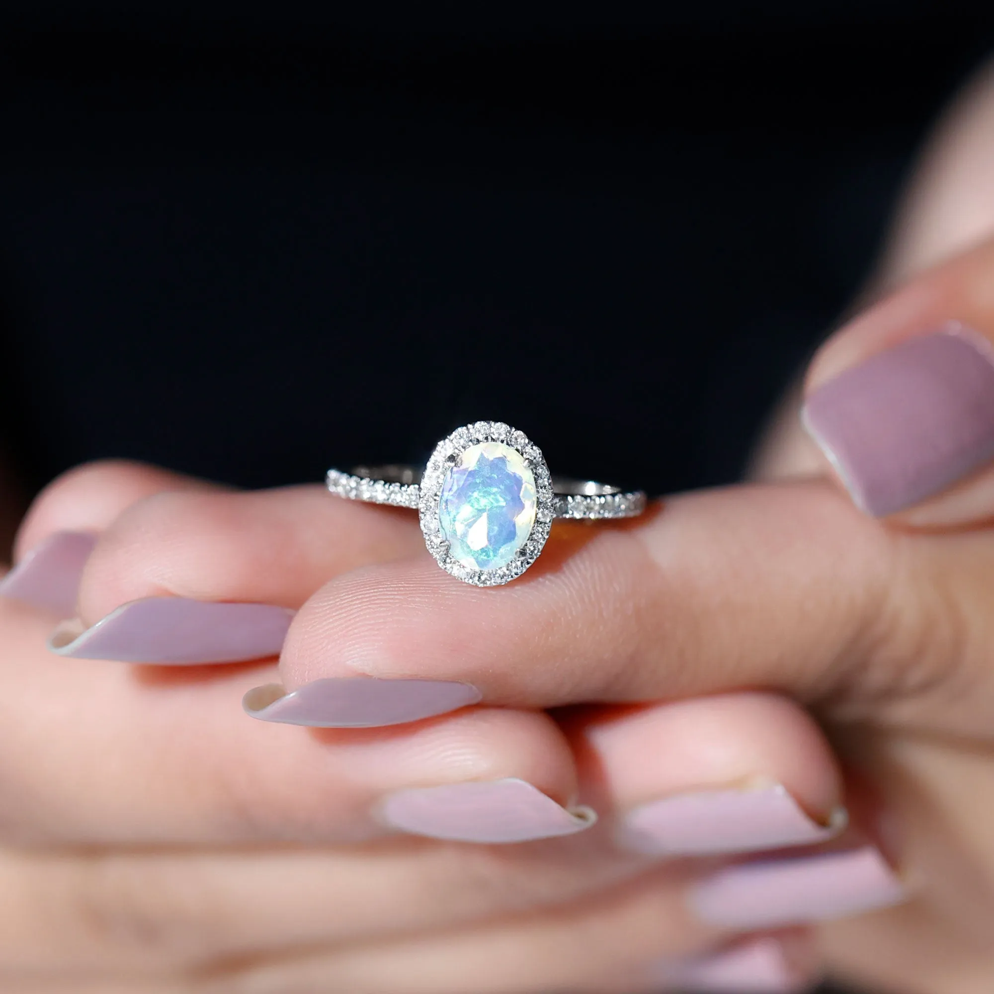 Oval Shape Ethiopian Opal and Diamond Halo Engagement Ring