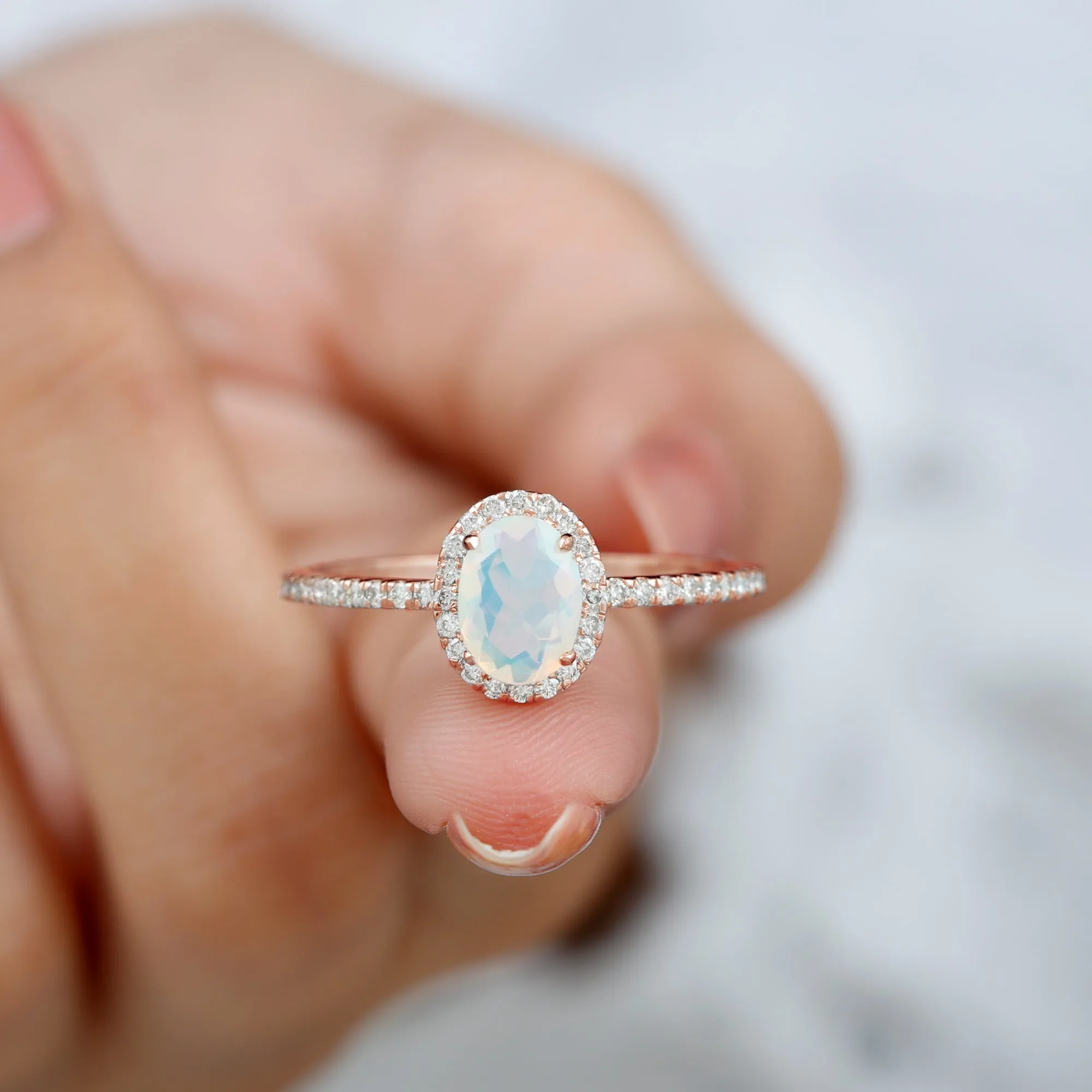 Oval Shape Ethiopian Opal and Diamond Halo Engagement Ring